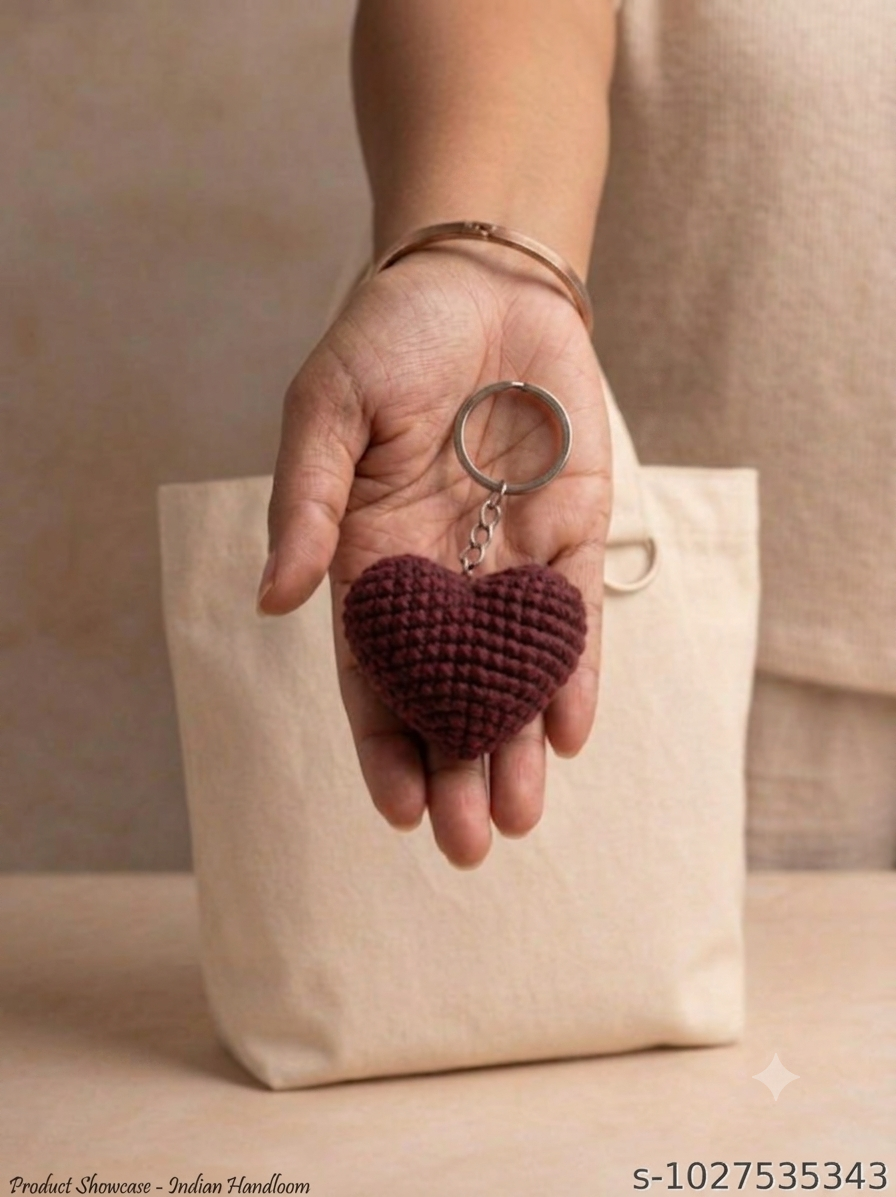 Lencho handmade crochet heart keychain and bag charm in maroon, product view