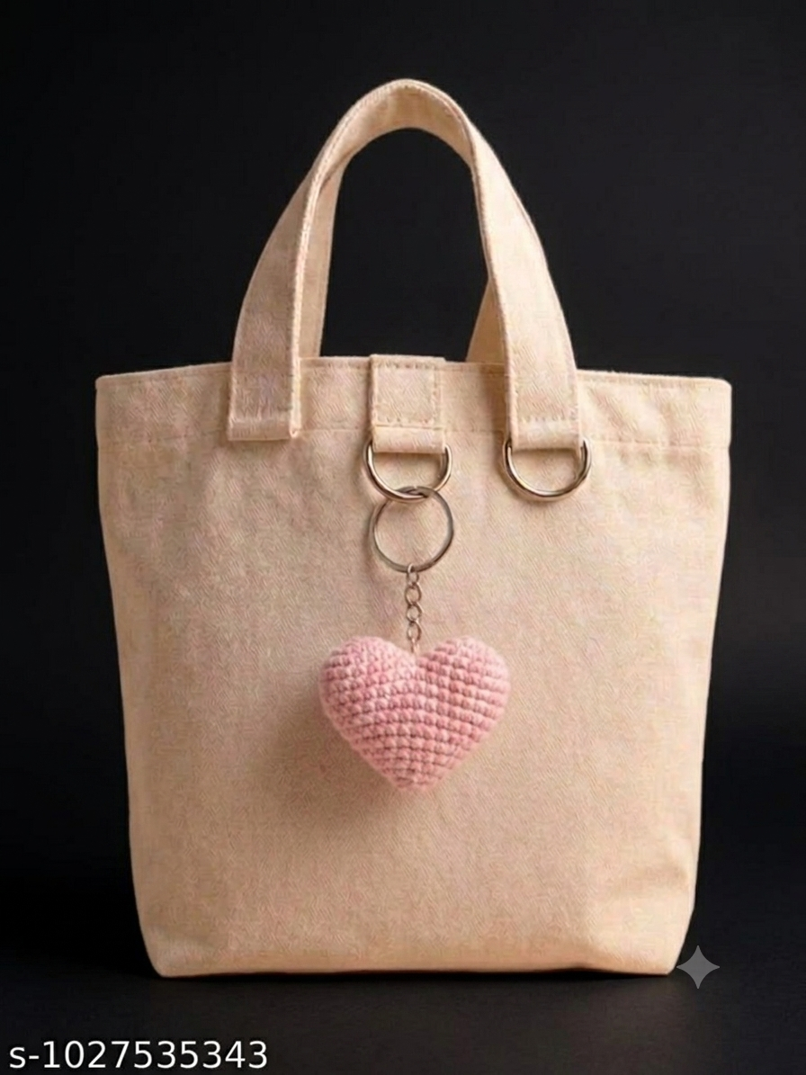 Lencho handmade crochet heart keychain and bag charm in pink, product view