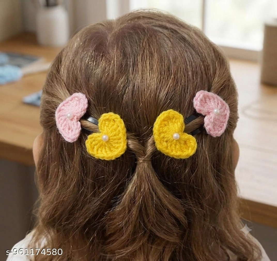 Lencho handmade crochet heart snap hair clips set of 4 in pink and yellow, lifestyle view