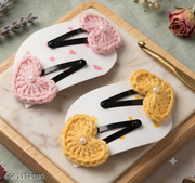 Lencho pink and yellow crochet heart snap hair clips set of 4, detail view